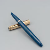 Parker 51 Aerometric (Teal Blue with gold converging lines cap)
